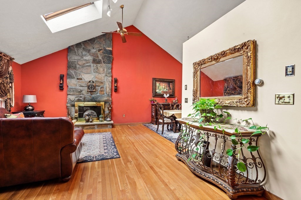 3 Macone Circle Stoneham, MA 02180 - Photo 12 of 26 a living room with furniture and a fireplace