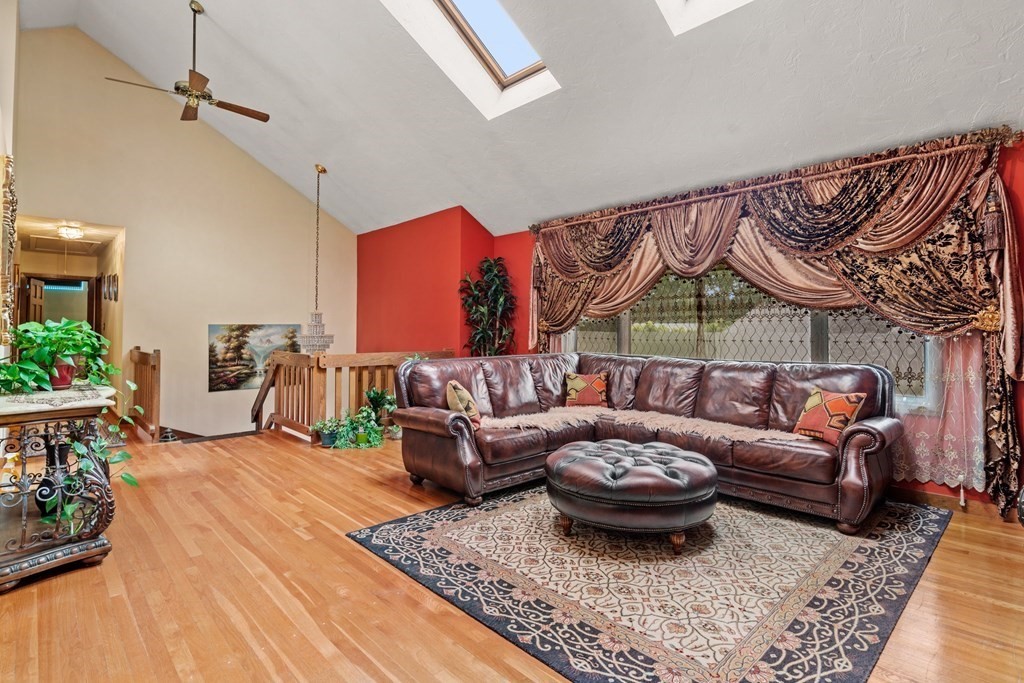 3 Macone Circle Stoneham, MA 02180 - Photo 13 of 26 a living room with furniture a rug and a potted plant