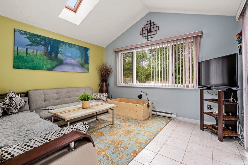 3 Macone Circle Stoneham, MA 02180 - Photo 15 of 26 a living room with furniture and a flat screen tv