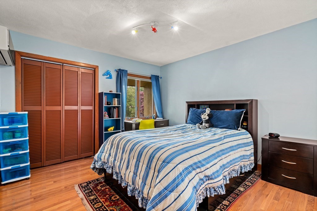 3 Macone Circle Stoneham, MA 02180 - Photo 16 of 26 a bedroom with a bed and closet