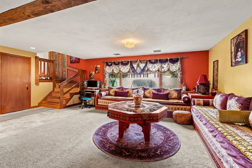 3 Macone Circle Stoneham, MA 02180 - Photo 21 of 26 a living room with furniture a rug and a large window