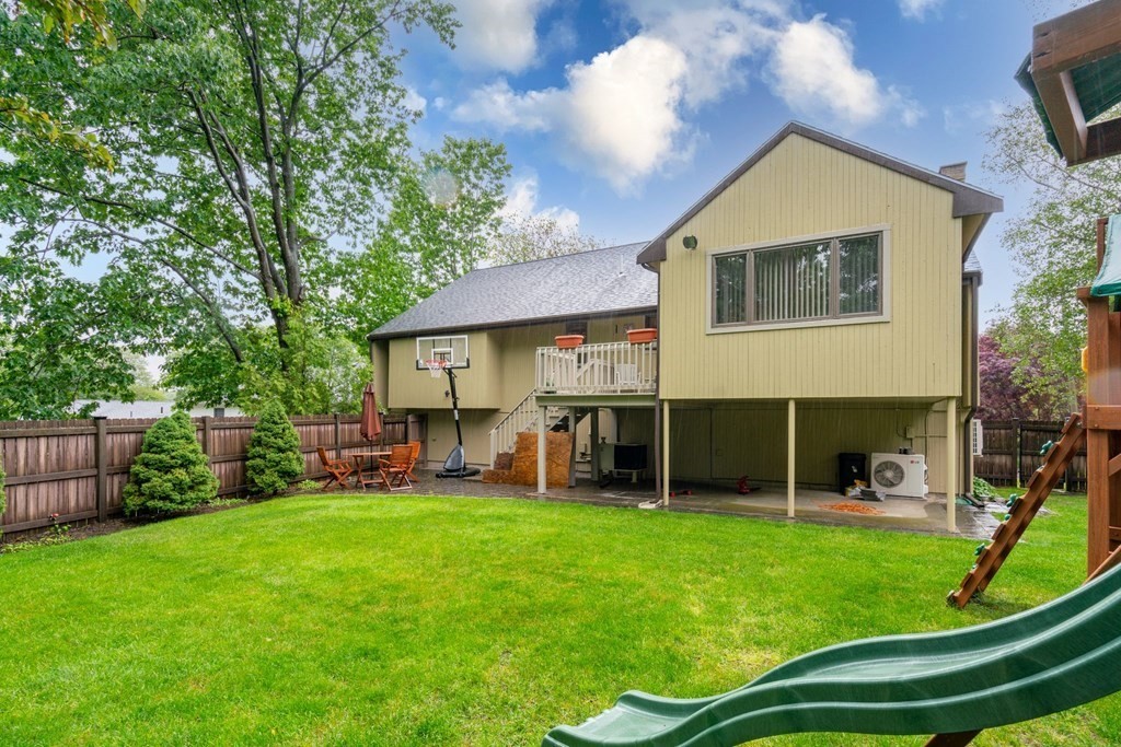 3 Macone Circle Stoneham, MA 02180 - Photo 3 of 26 a view of a house with a yard and sitting area