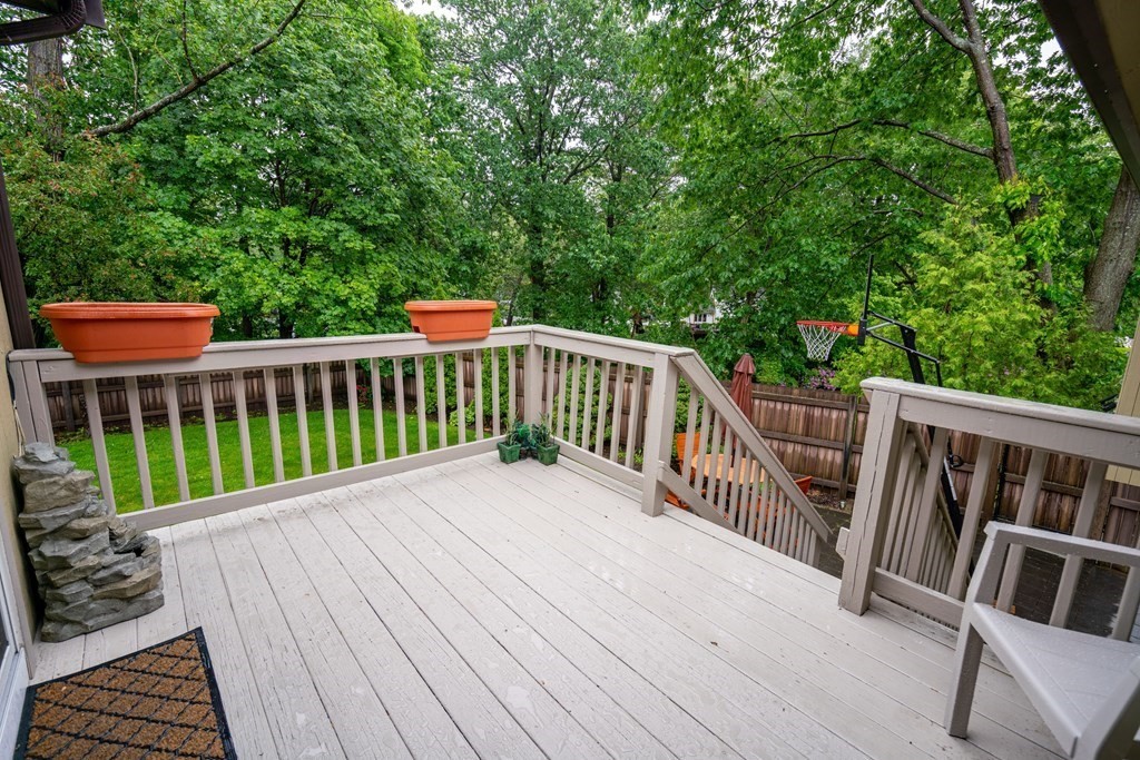 3 Macone Circle Stoneham, MA 02180 - Photo 5 of 26 a view of balcony with wooden floor and fence