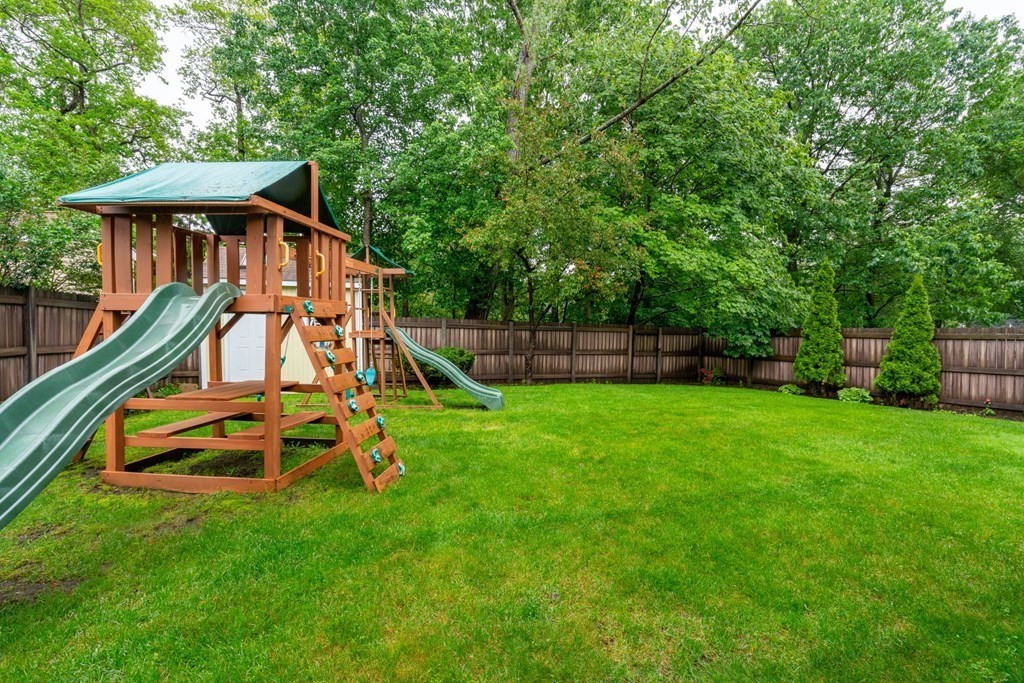 3 Macone Circle Stoneham, MA 02180 - Photo 6 of 26 a view of a house with a backyard