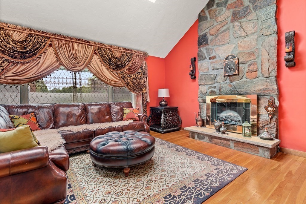 3 Macone Circle Stoneham, MA 02180 - Photo 10 of 26 a living room with furniture and a fireplace