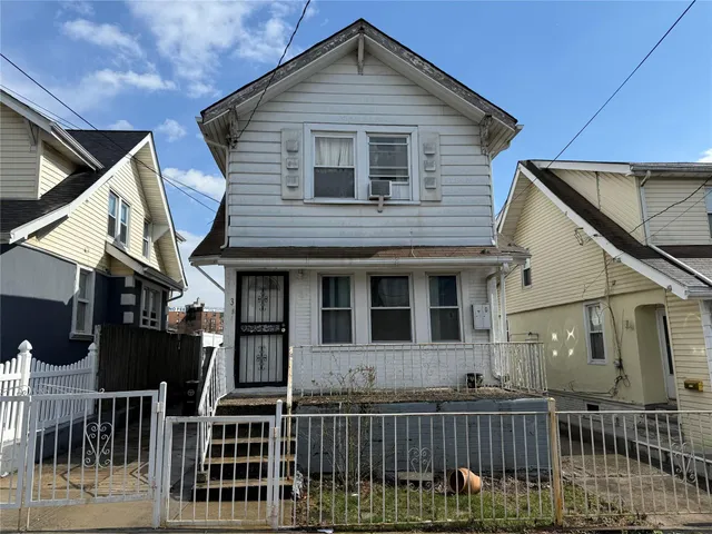 a front view of house with deck and outdoor seating