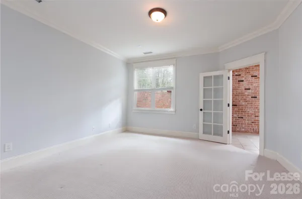 a view of empty room with windows