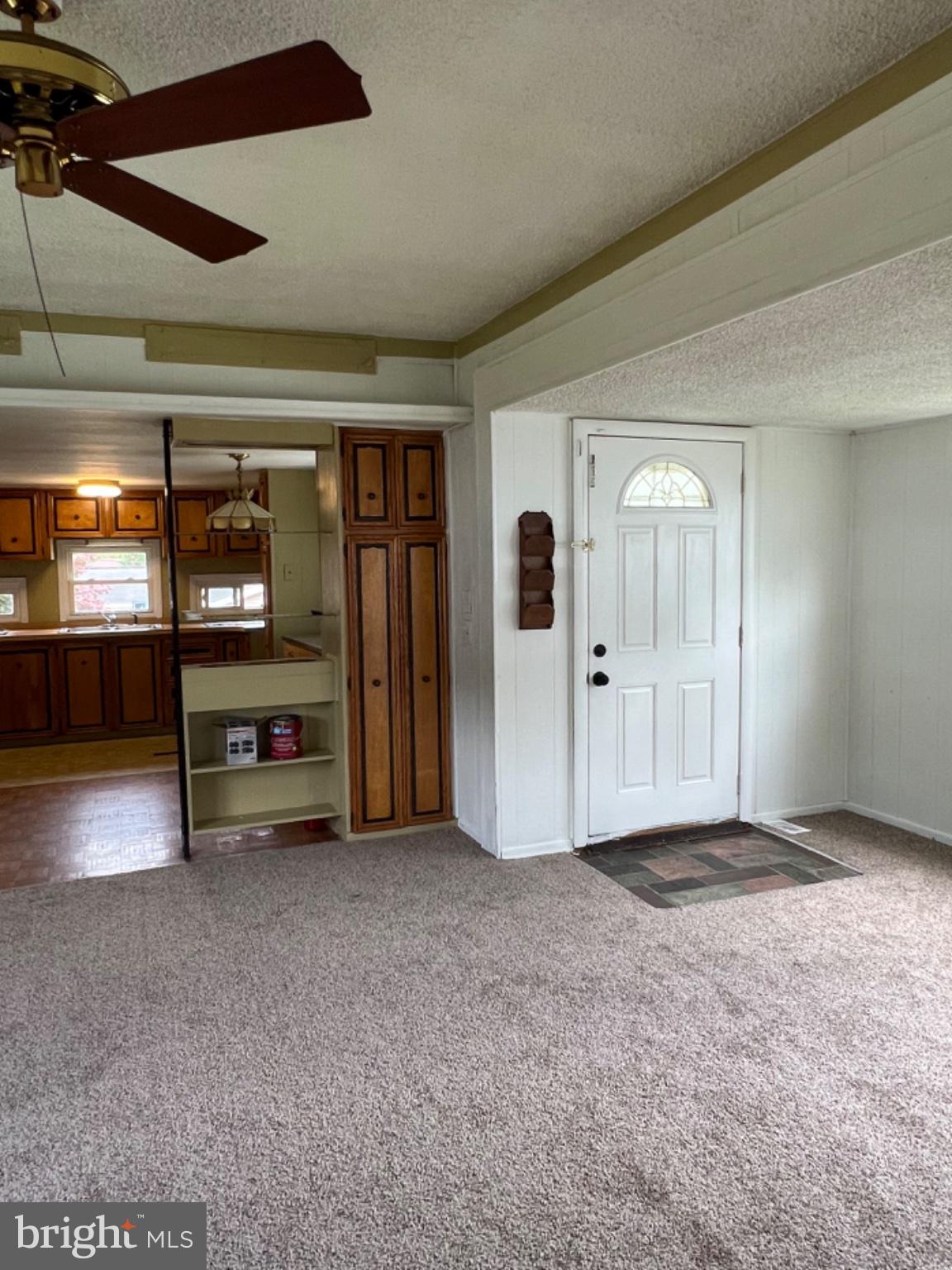 1302 Gibson Road, Unit 152 Bensalem, PA 19020 - Photo 6 of 18 a view of a livingroom with an empty room