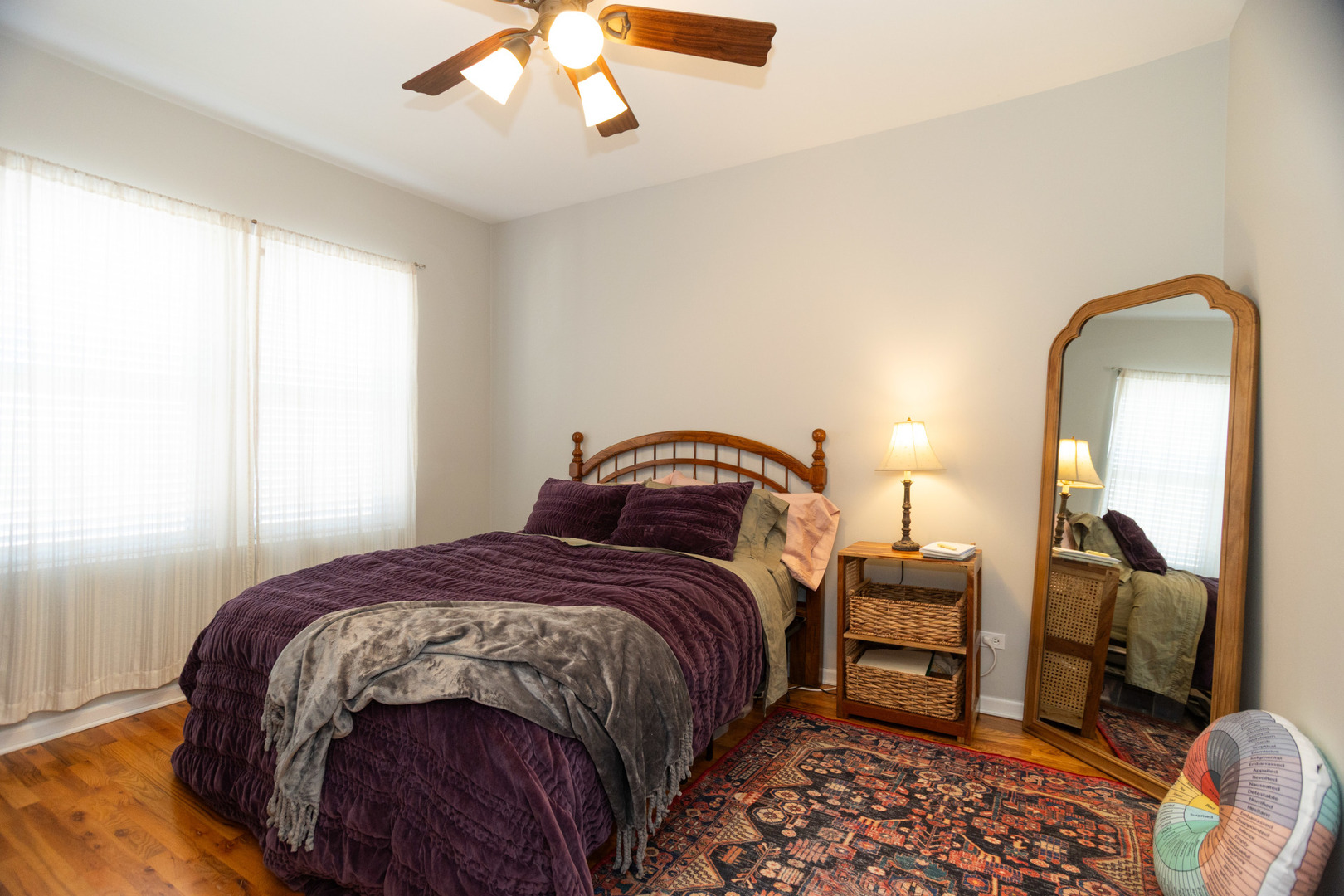 2709 West Lawrence Avenue, Unit 3 Chicago, IL 60625 - Photo 12 of 16 a bedroom with bed and a mirror