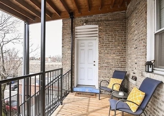 2709 West Lawrence Avenue, Unit 3 Chicago, IL 60625 - Photo 15 of 16 a view of a balcony with chairs
