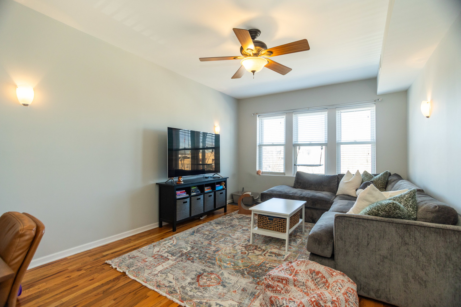2709 West Lawrence Avenue, Unit 3 Chicago, IL 60625 - Photo 2 of 16 a living room with furniture and a flat screen tv