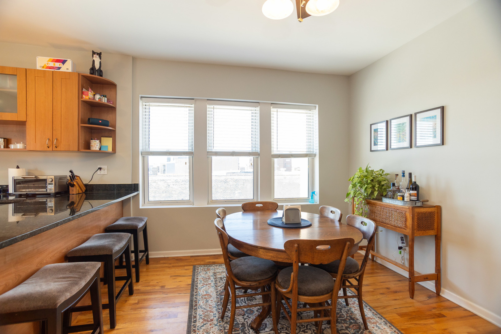 2709 West Lawrence Avenue, Unit 3 Chicago, IL 60625 - Photo 6 of 16 a view of a dining room with furniture and wooden floor