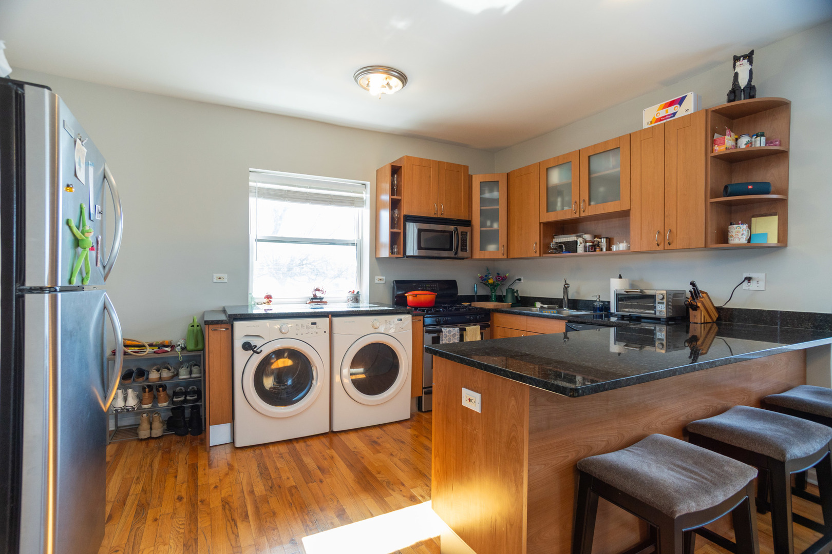 2709 West Lawrence Avenue, Unit 3 Chicago, IL 60625 - Photo 8 of 16 a kitchen with a stove a sink and a refrigerator