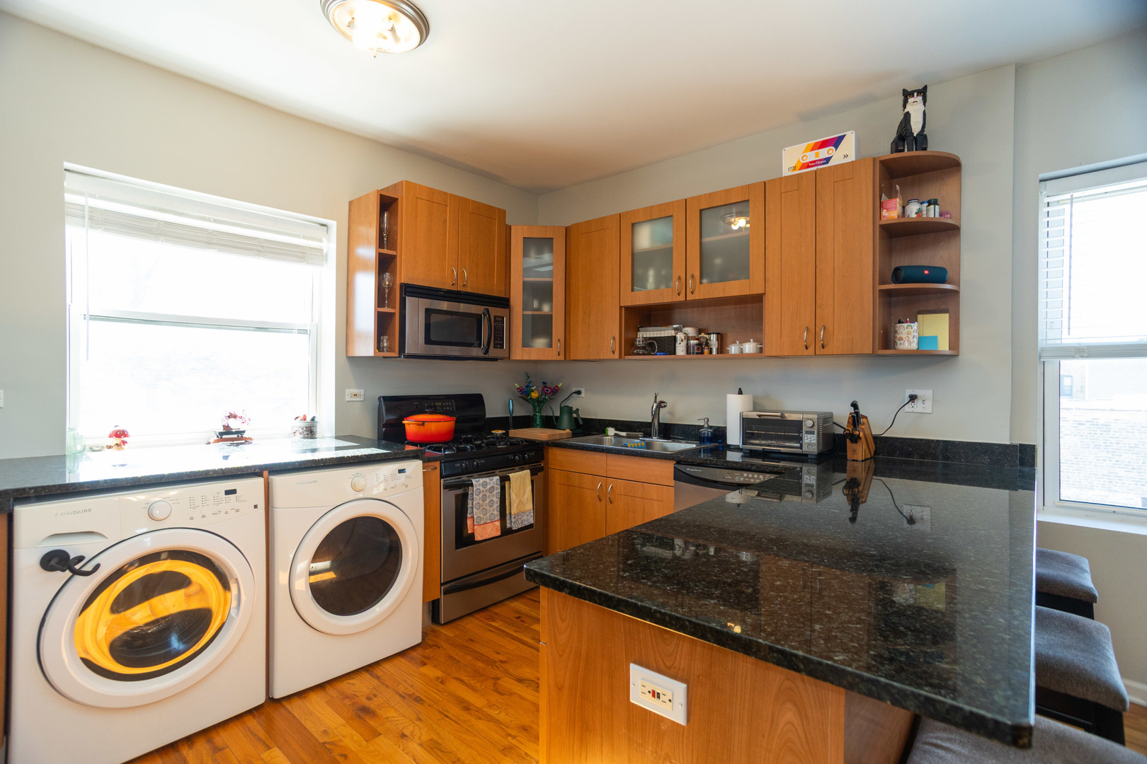 2709 West Lawrence Avenue, Unit 3 Chicago, IL 60625 - Photo 9 of 16 a kitchen with a stove a sink and a microwave