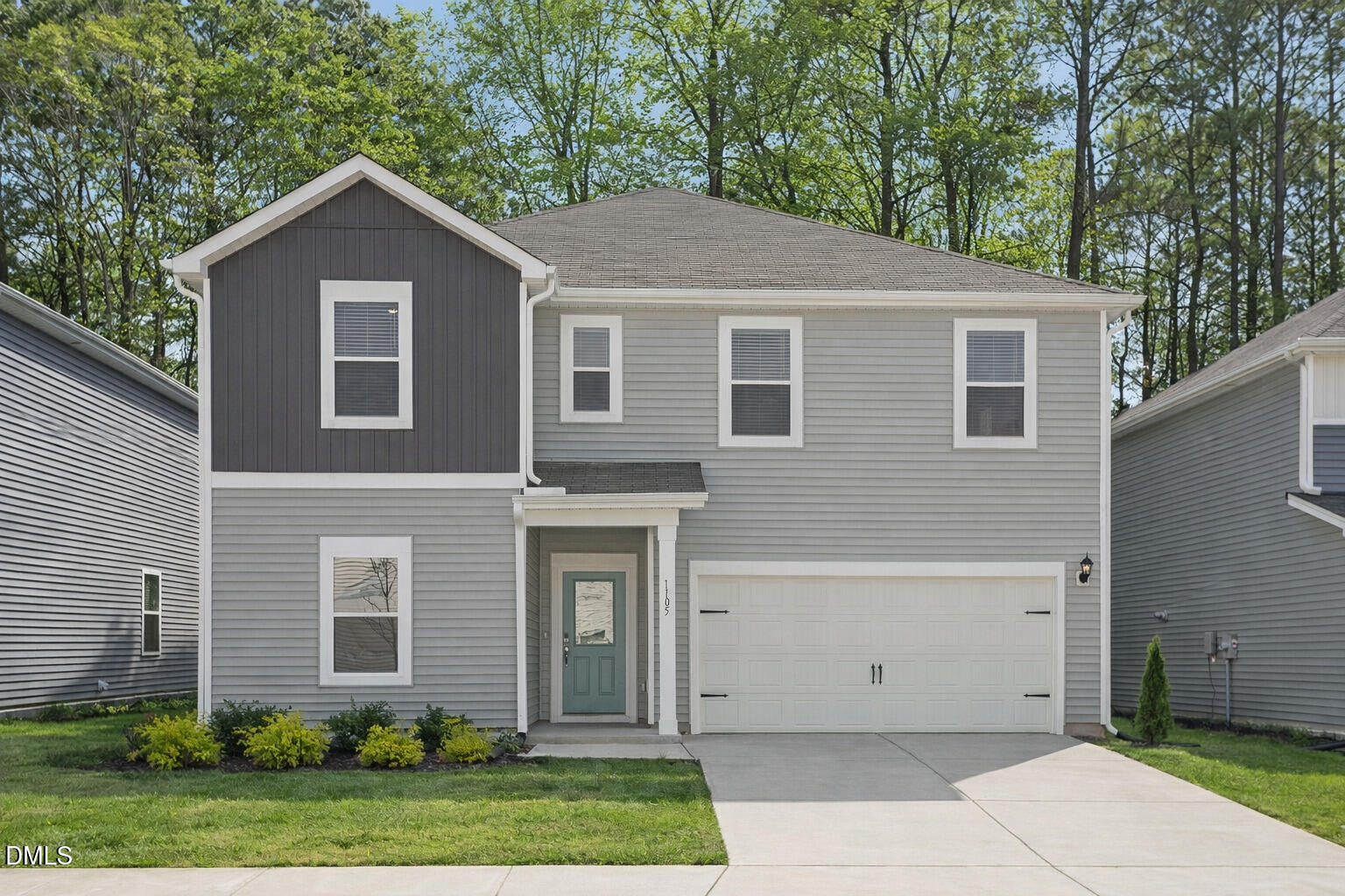 1105 Umstead Grv Way Durham, NC 27712 - Photo 1 of 38 a front view of a house with garden