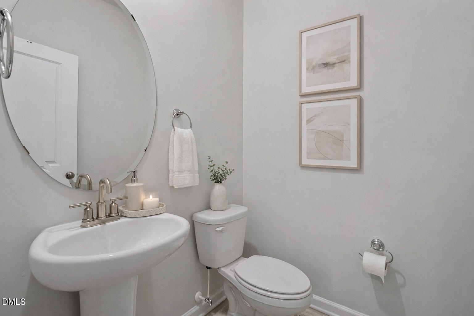 1105 Umstead Grv Way Durham, NC 27712 - Photo 11 of 38 a bathroom with a toilet sink and mirror