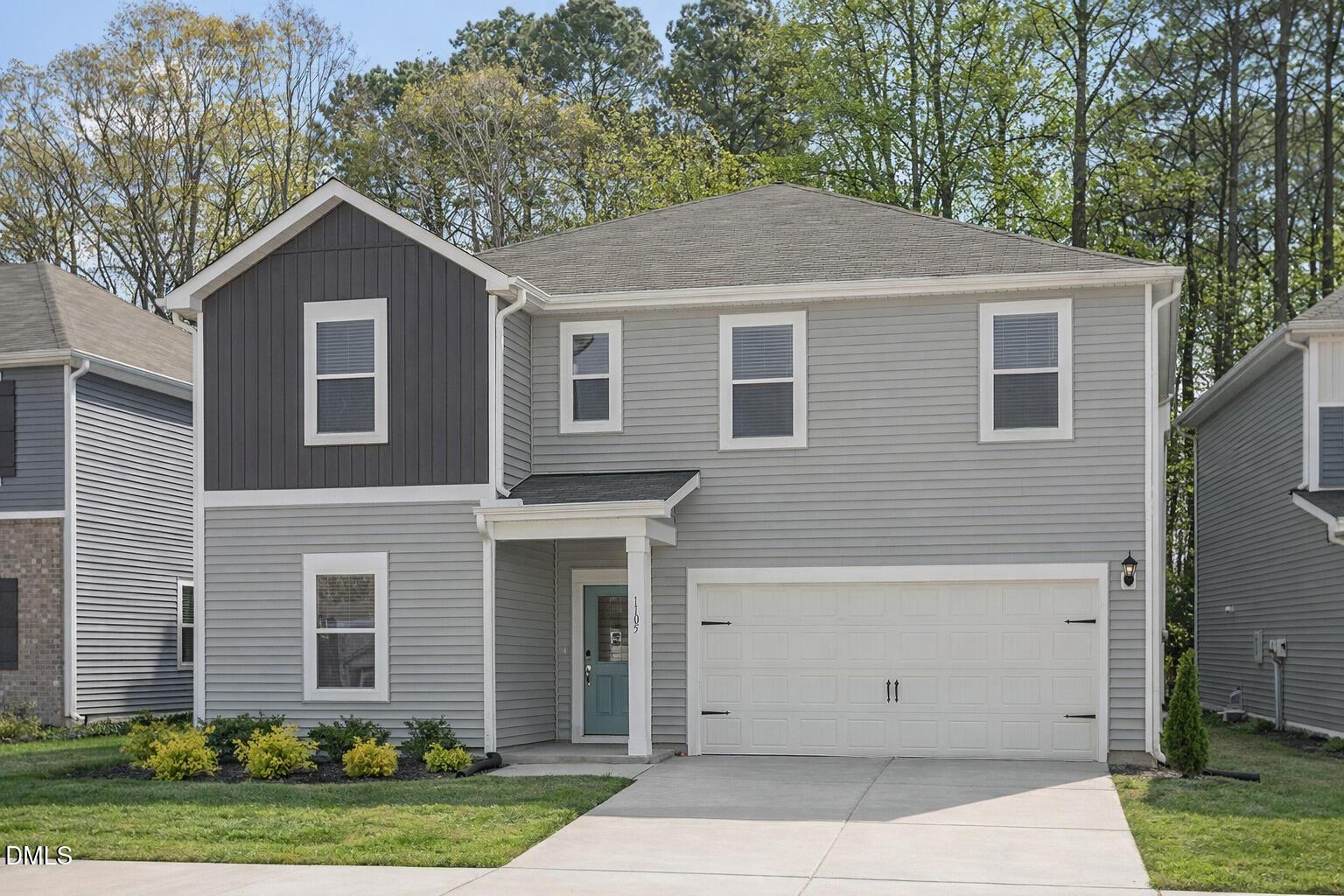 1105 Umstead Grv Way Durham, NC 27712 - Photo 2 of 38 a front view of a house with a yard and garage