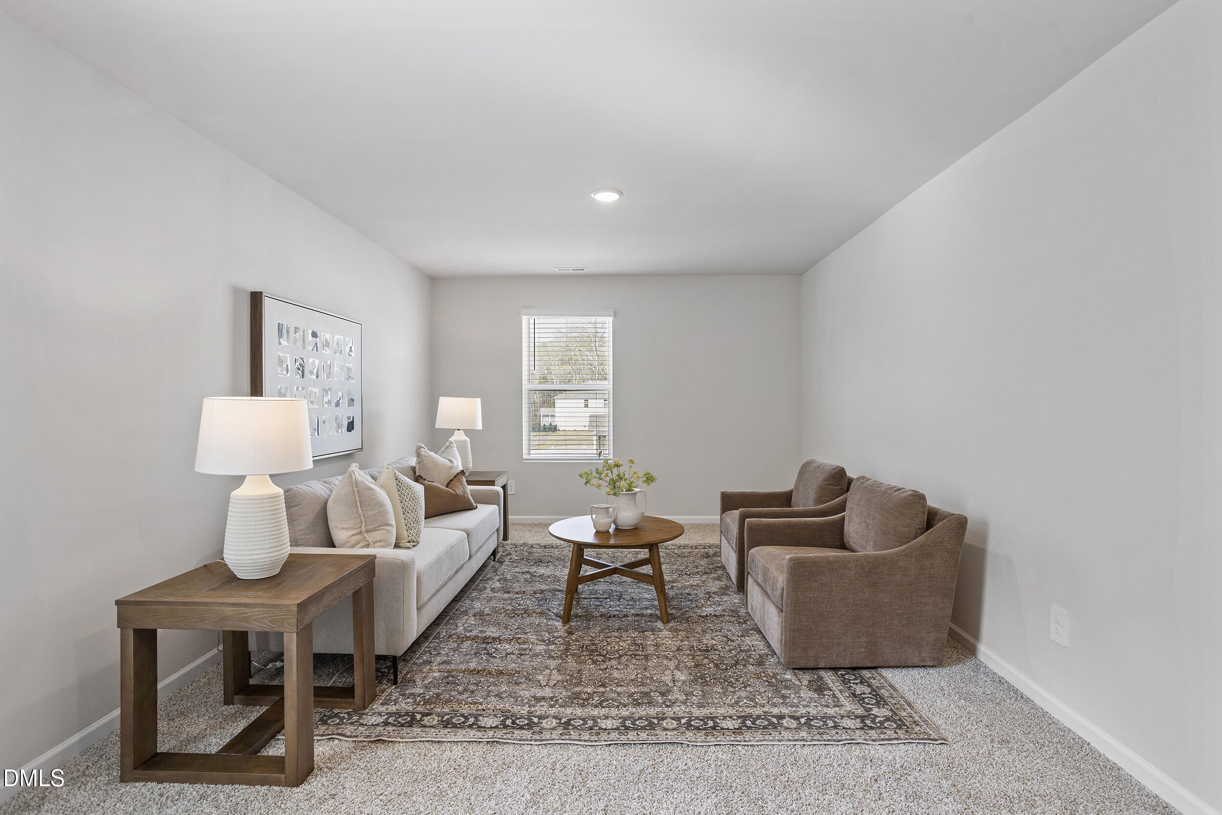 1105 Umstead Grv Way Durham, NC 27712 - Photo 22 of 38 a living room with furniture and a potted plant on table