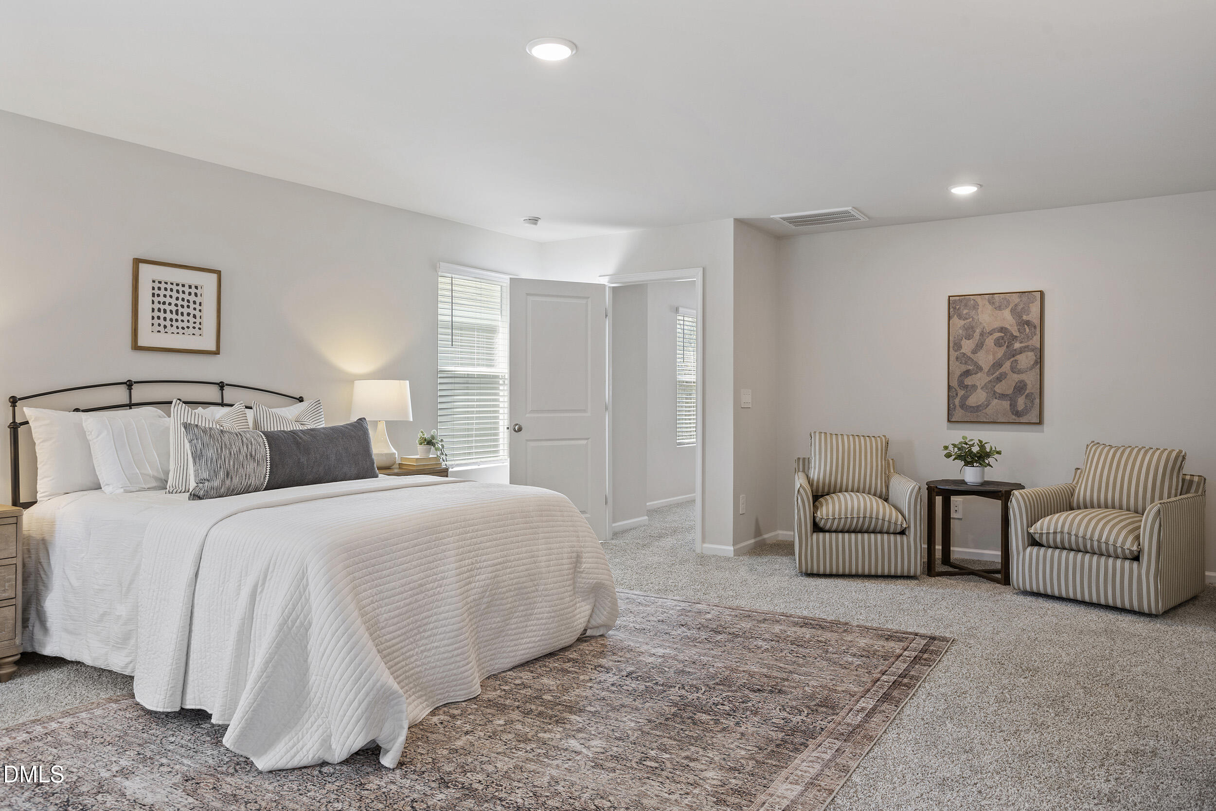 1105 Umstead Grv Way Durham, NC 27712 - Photo 26 of 38 a bedroom with a bed and a couch