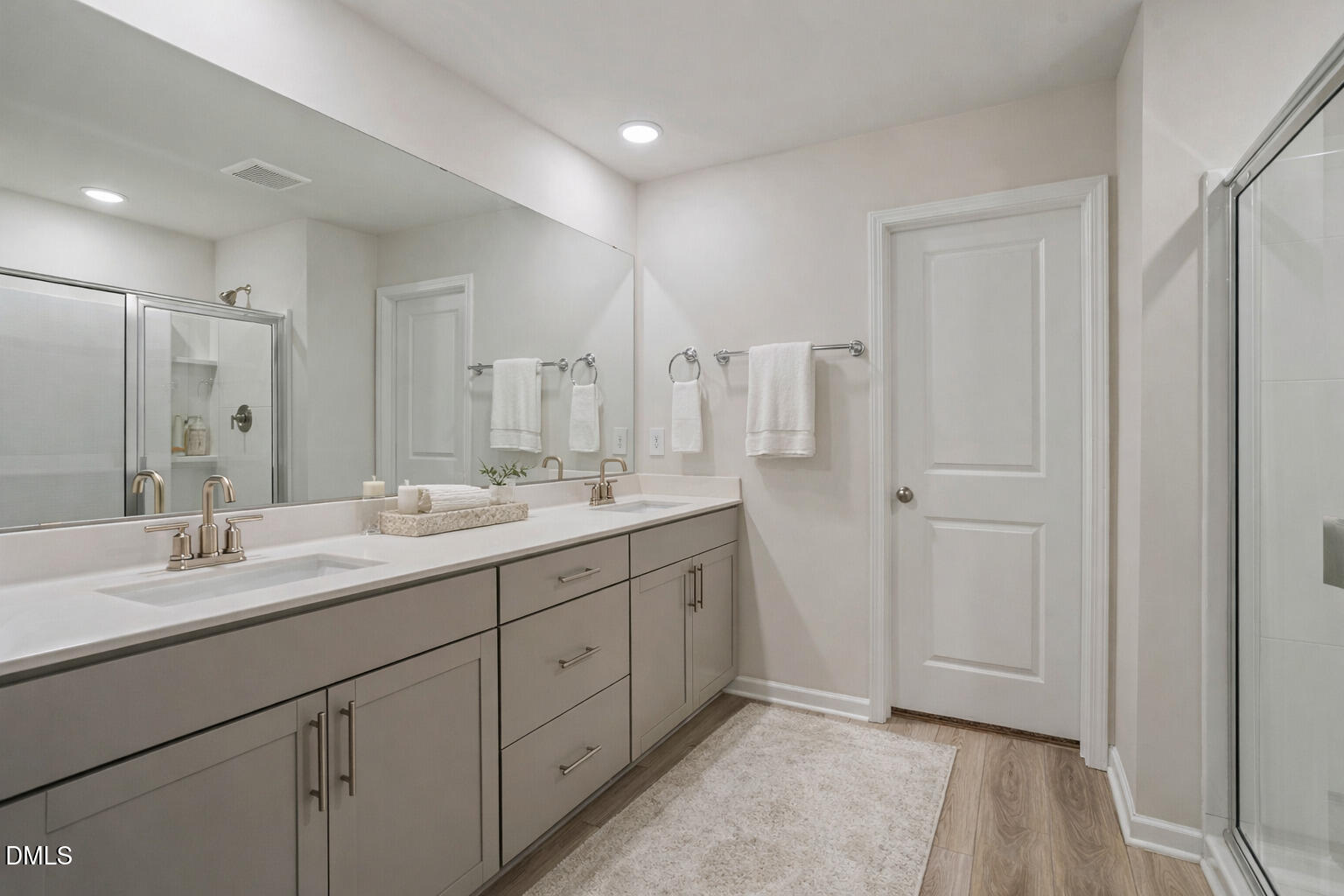1105 Umstead Grv Way Durham, NC 27712 - Photo 27 of 38 a bathroom with a double vanity sink and mirror