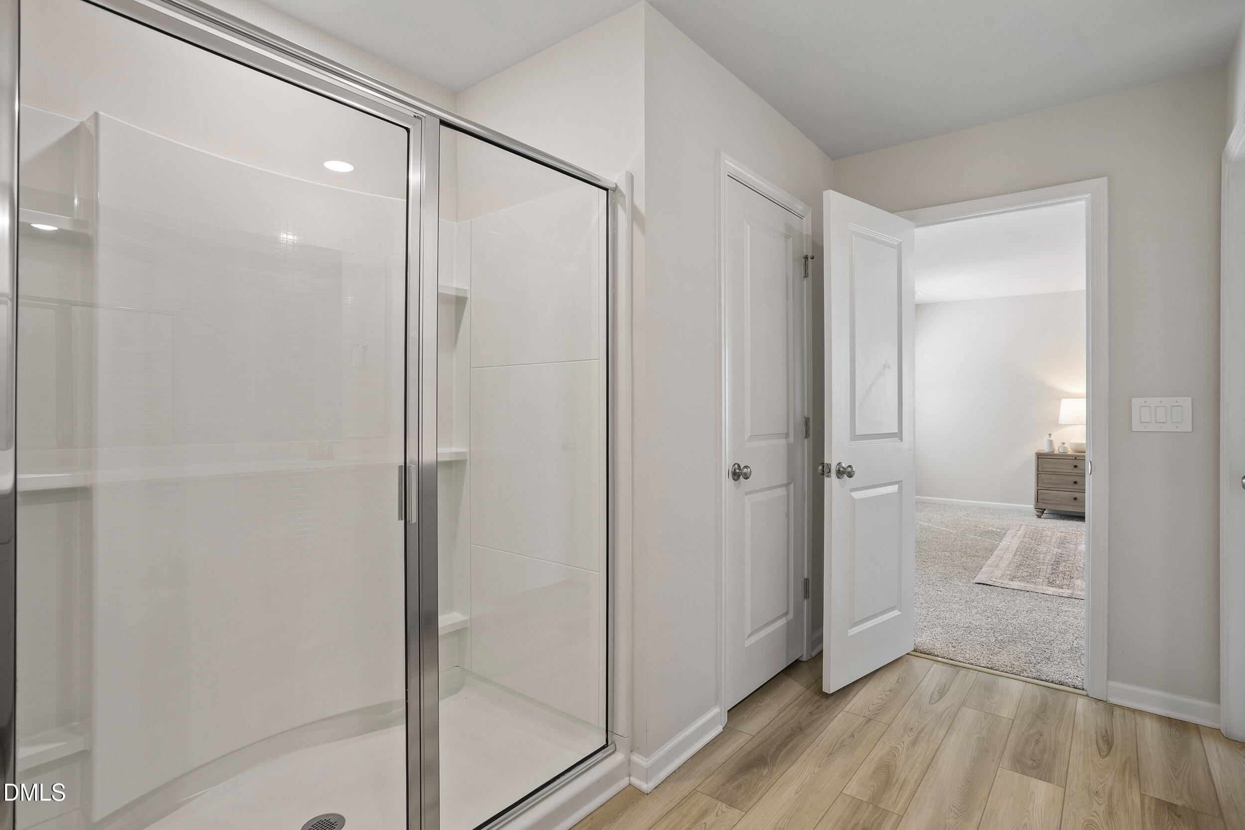 1105 Umstead Grv Way Durham, NC 27712 - Photo 28 of 38 a bathroom with a shower and a glass door