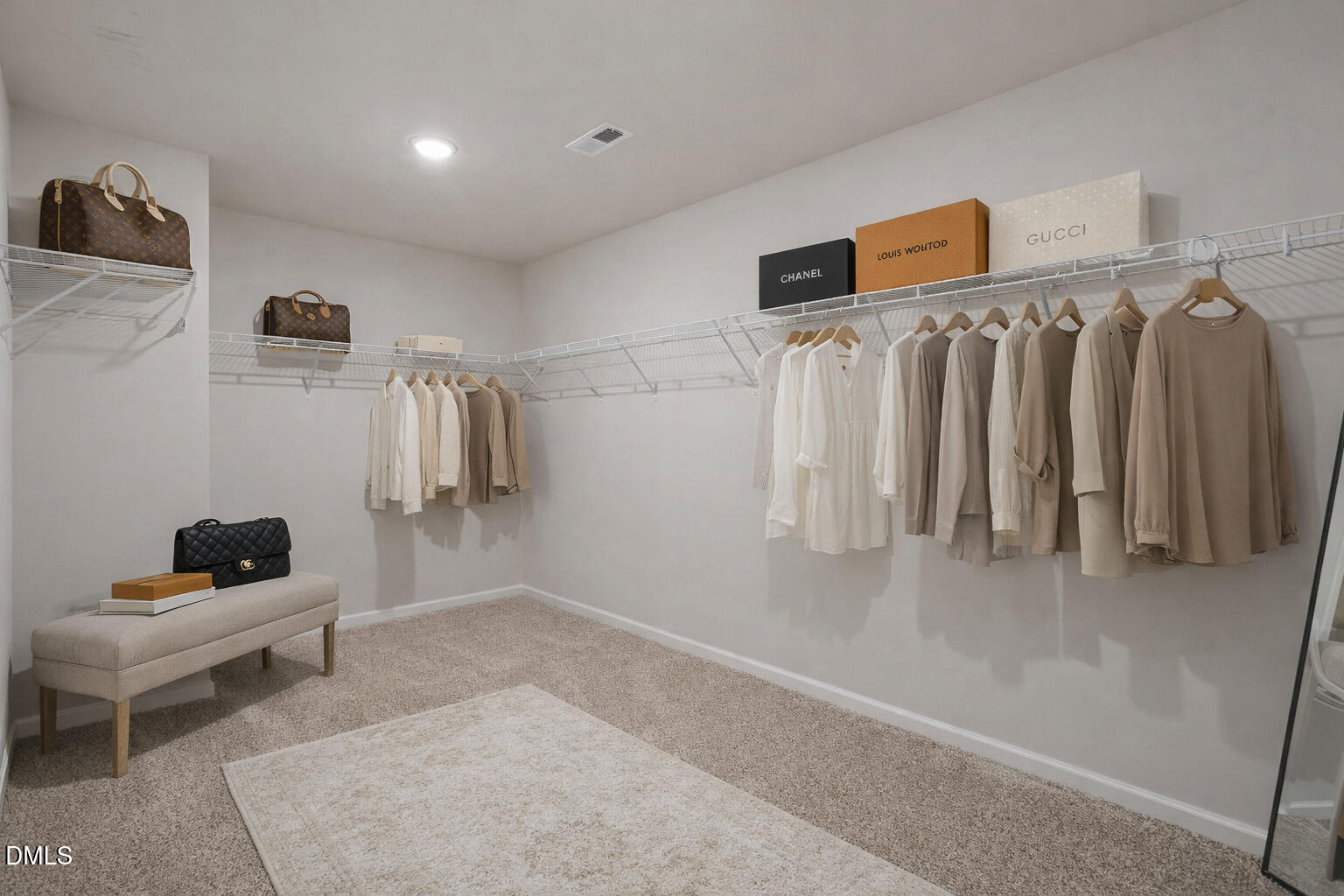 1105 Umstead Grv Way Durham, NC 27712 - Photo 29 of 38 a view of walk in closet with clothes and shoes