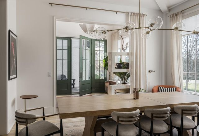 a kitchen with granite countertop a sink stove and cabinets