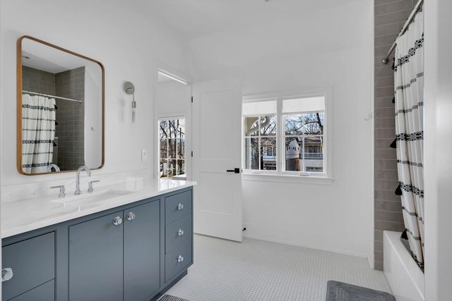 a view of a patio with couches table and chairs and potted plants