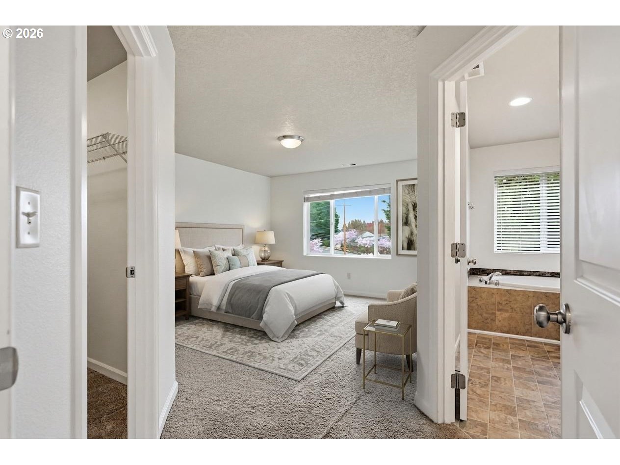 20881 Southwest Edgemont Street Beaverton, OR 97003 - Photo 11 of 39 a bedroom with a large bed and a window