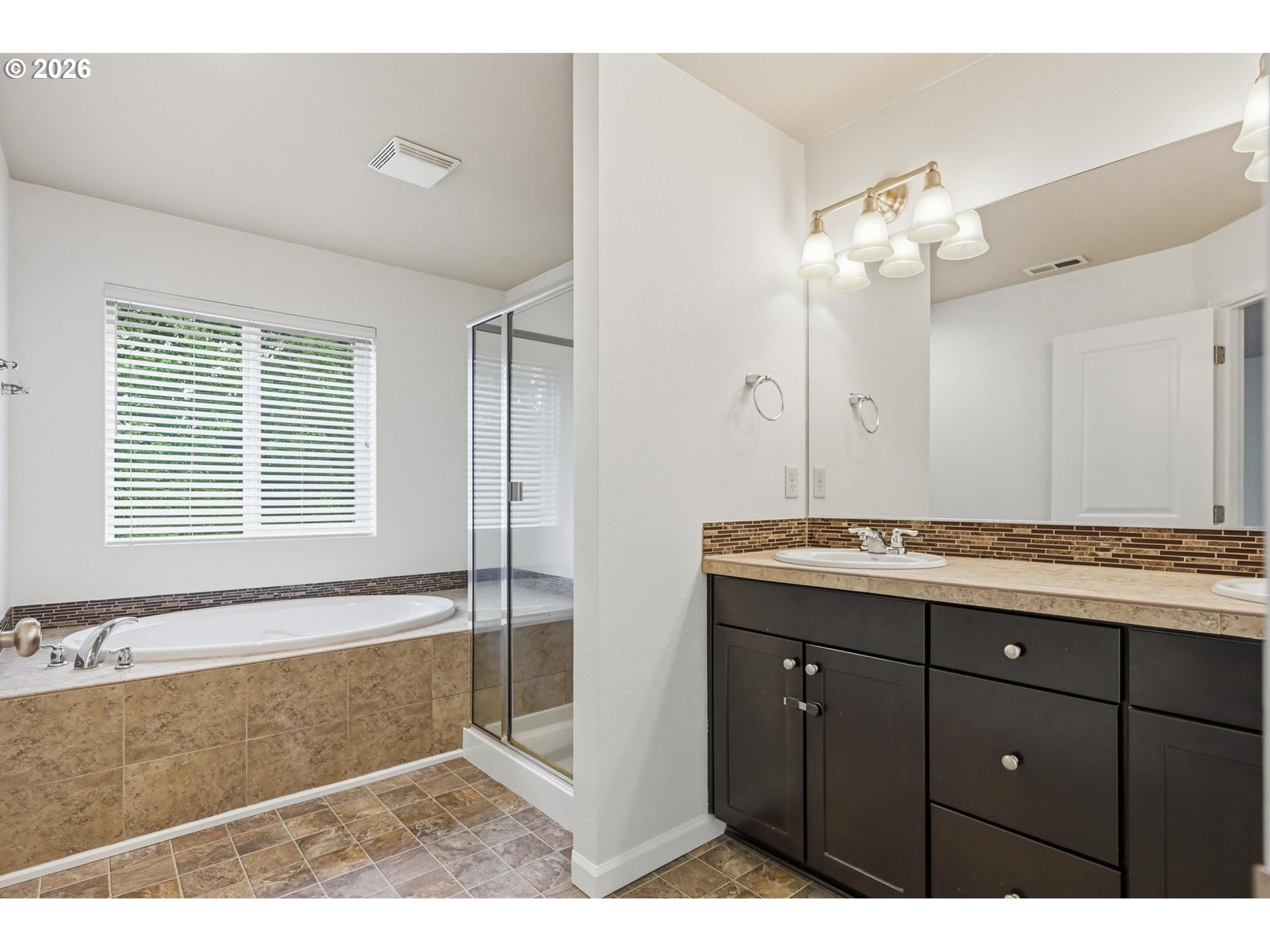 20881 Southwest Edgemont Street Beaverton, OR 97003 - Photo 13 of 39 a bathroom with a granite countertop sink a mirror and a bathtub