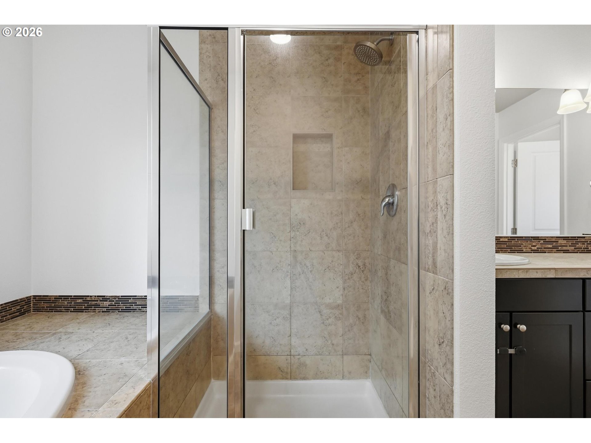 20881 Southwest Edgemont Street Beaverton, OR 97003 - Photo 15 of 39 a bathroom with a granite countertop sink a mirror and shower