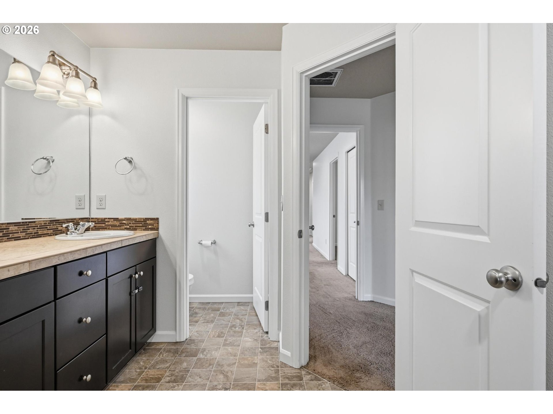 20881 Southwest Edgemont Street Beaverton, OR 97003 - Photo 16 of 39 a bathroom with a sink and a mirror