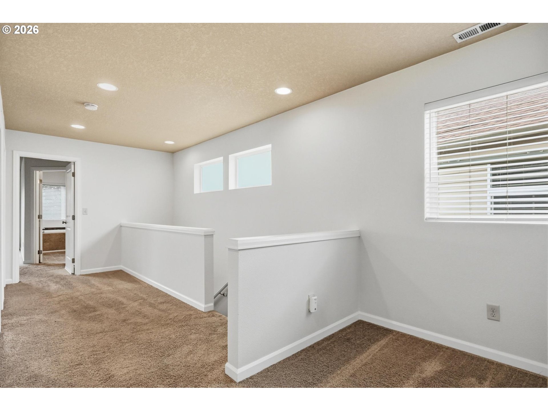 20881 Southwest Edgemont Street Beaverton, OR 97003 - Photo 19 of 39 a view of an empty room with wooden floor