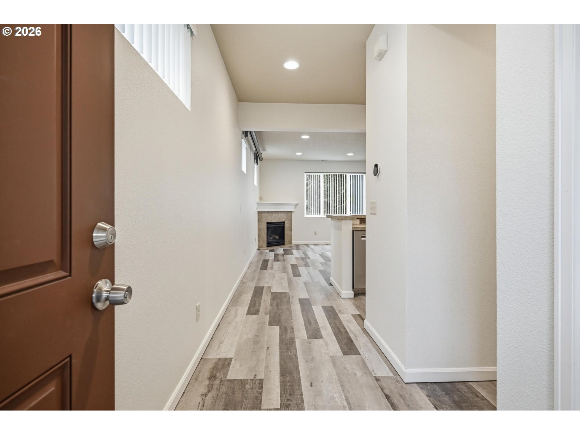 20881 Southwest Edgemont Street Beaverton, OR 97003 - Photo 2 of 39 a view of a hallway with wooden floor and staircase