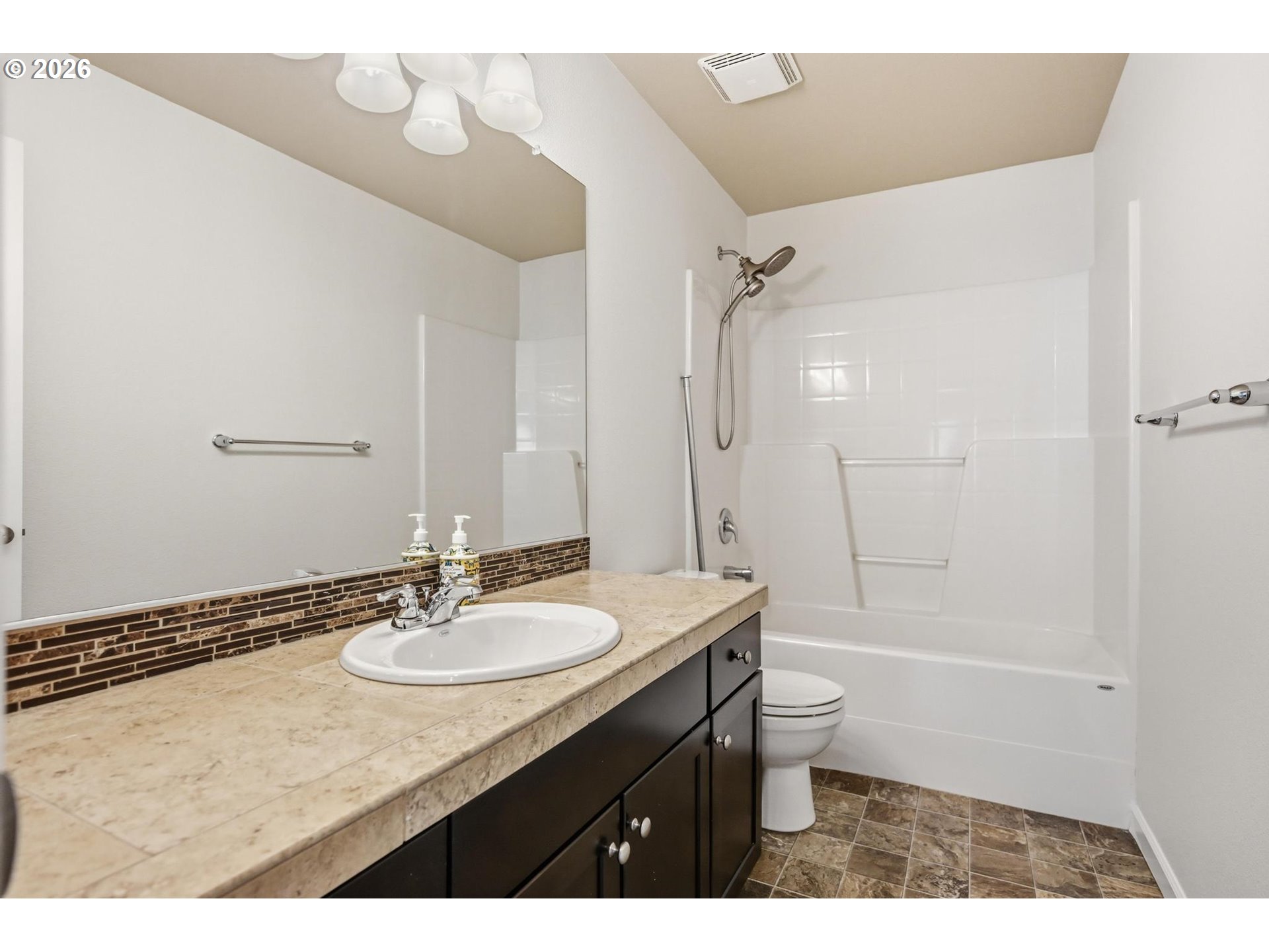 20881 Southwest Edgemont Street Beaverton, OR 97003 - Photo 26 of 39 a bathroom with a granite countertop sink mirror toilet and bathtub