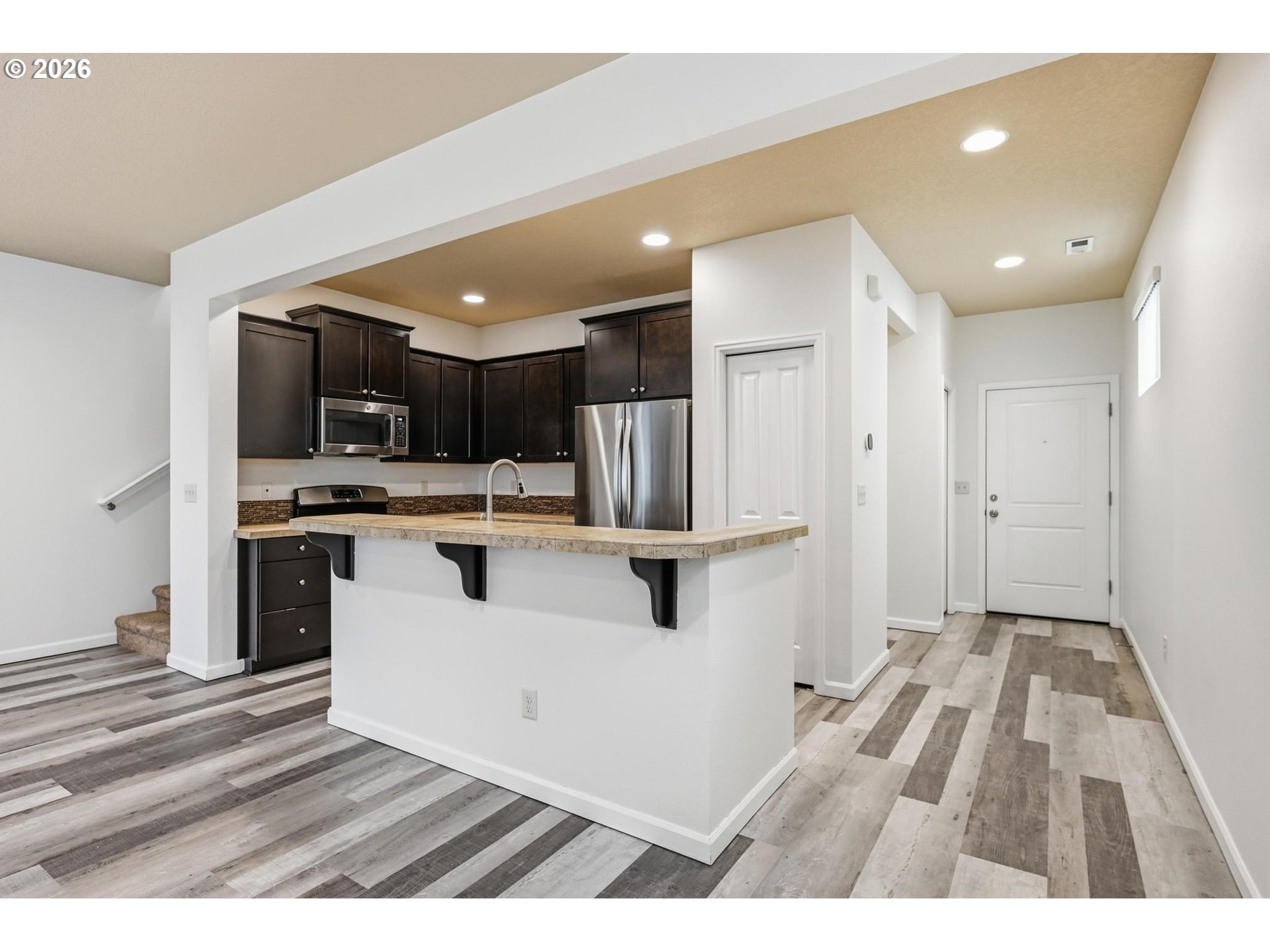 20881 Southwest Edgemont Street Beaverton, OR 97003 - Photo 8 of 39 a view of kitchen with wooden floor