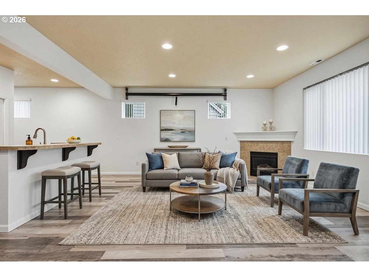 20881 Southwest Edgemont Street Beaverton, OR 97003 - Photo 9 of 39 a living room with furniture and a fireplace