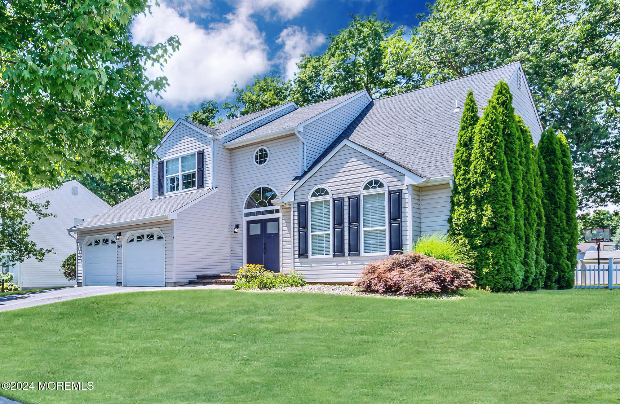 161 Old Orchard Road Toms River, NJ 08755 - Photo 1 of 32 a front view of a house with a garden and plants