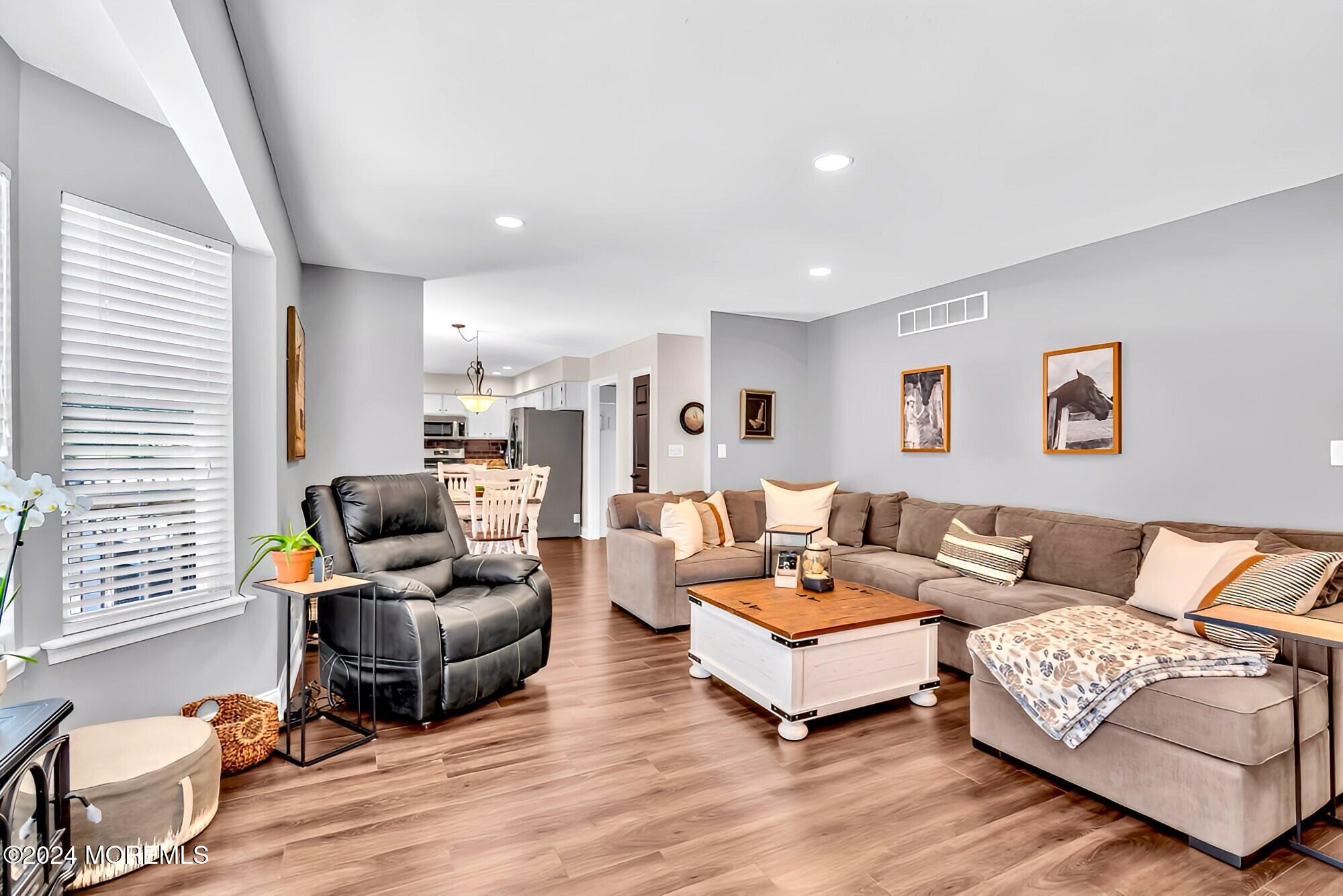 161 Old Orchard Road Toms River, NJ 08755 - Photo 11 of 32 a living room with furniture rug and wooden floor