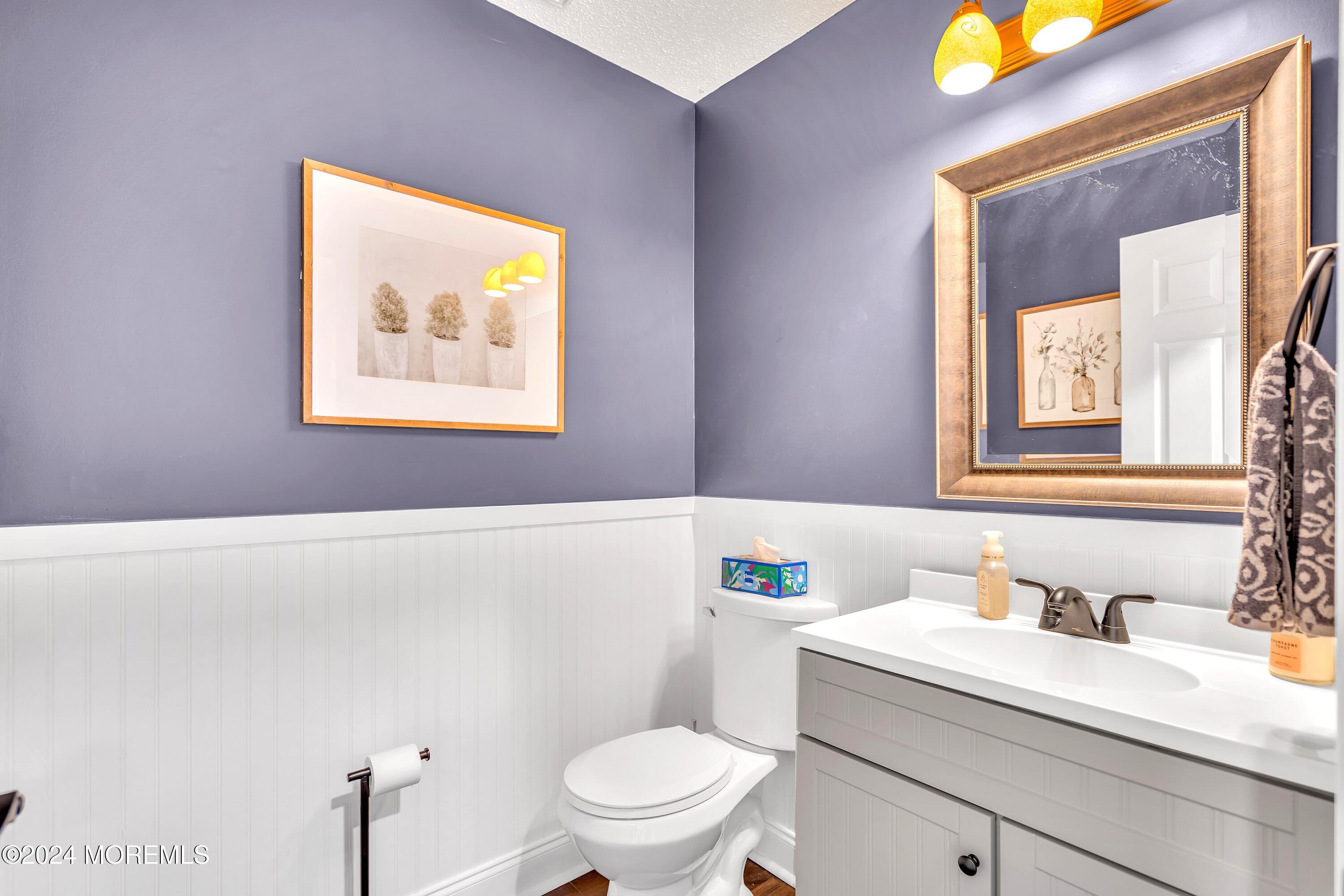161 Old Orchard Road Toms River, NJ 08755 - Photo 14 of 32 a bathroom with a granite countertop sink mirror vanity and toilet