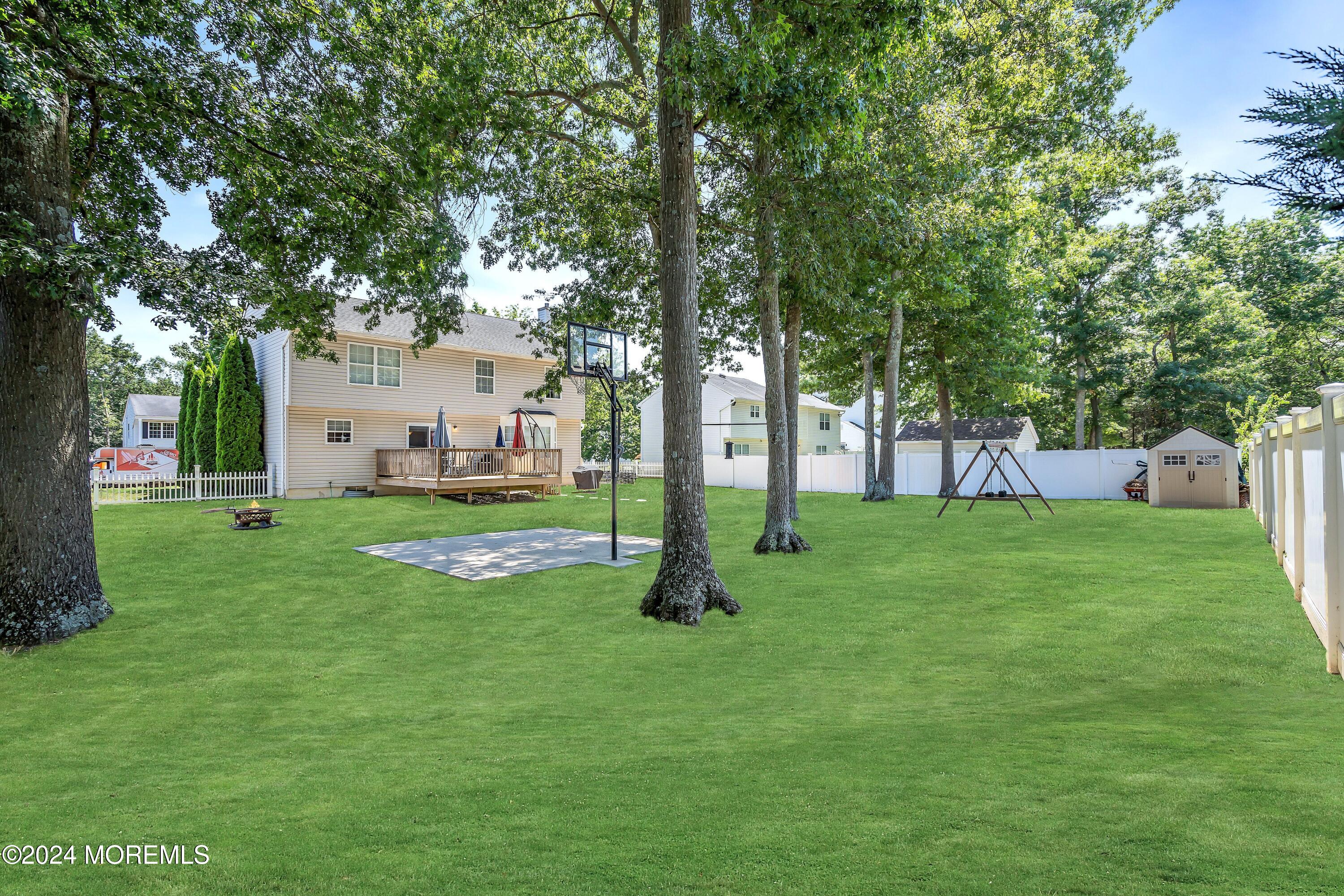 161 Old Orchard Road Toms River, NJ 08755 - Photo 31 of 32 a view of a house with a backyard