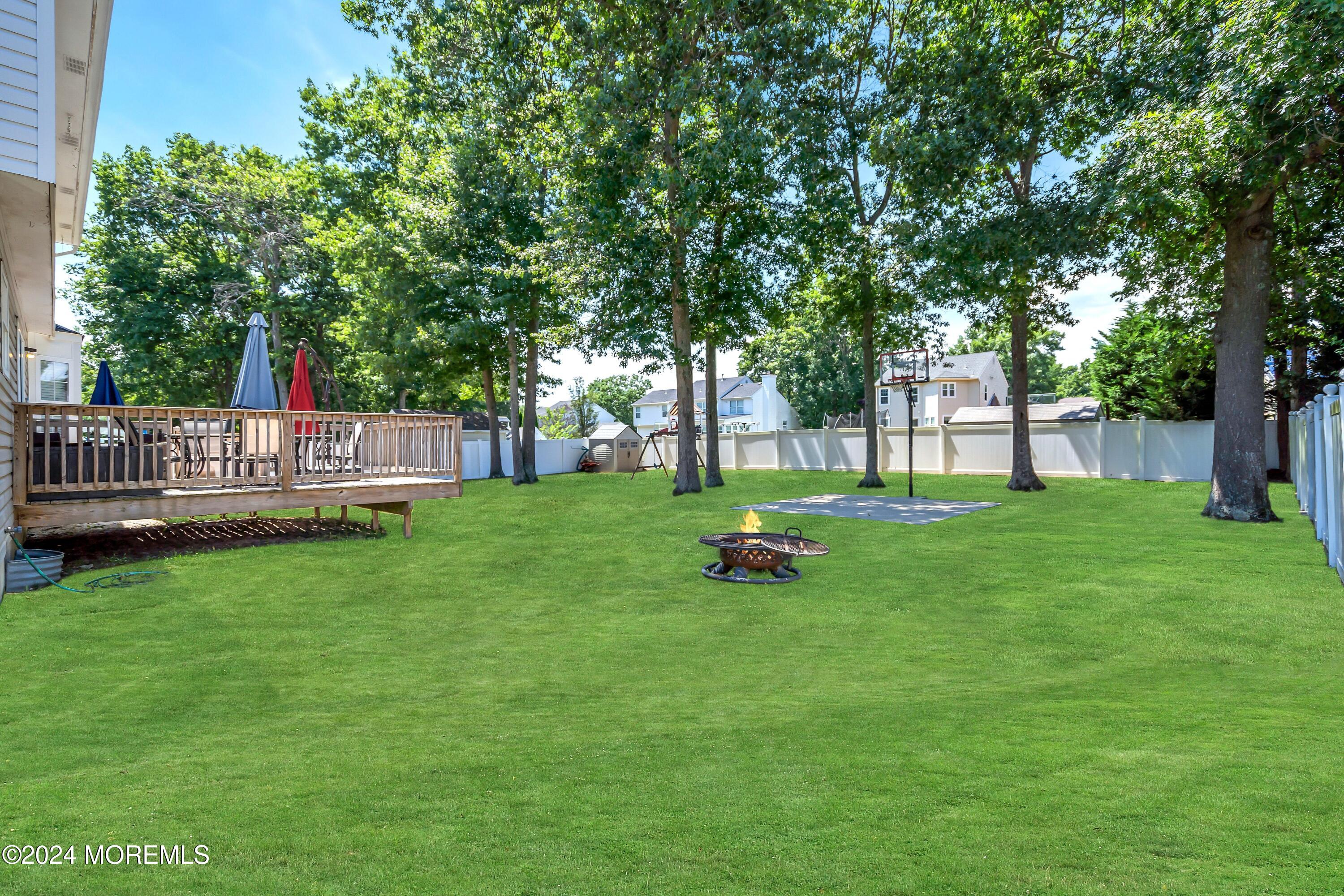 161 Old Orchard Road Toms River, NJ 08755 - Photo 32 of 32 a view of house with backyard and a slide