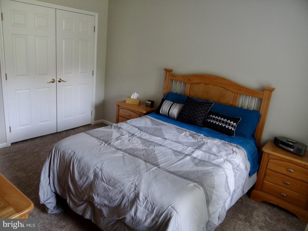126 Green Street Mount Holly, NJ 08060 - Photo 13 of 41 a bedroom with a bed and a window