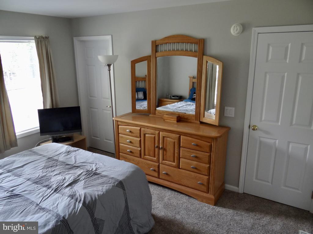 126 Green Street Mount Holly, NJ 08060 - Photo 14 of 41 a bedroom with a bed and a mirror on dresser