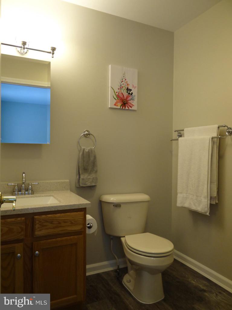 126 Green Street Mount Holly, NJ 08060 - Photo 15 of 41 a bathroom with a toilet sink vanity and mirror
