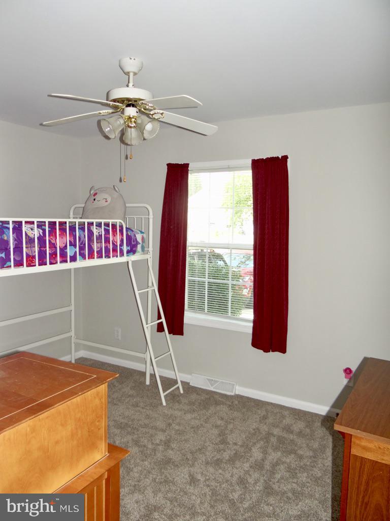 126 Green Street Mount Holly, NJ 08060 - Photo 21 of 41 a view of a room with a ceiling fan and a rug