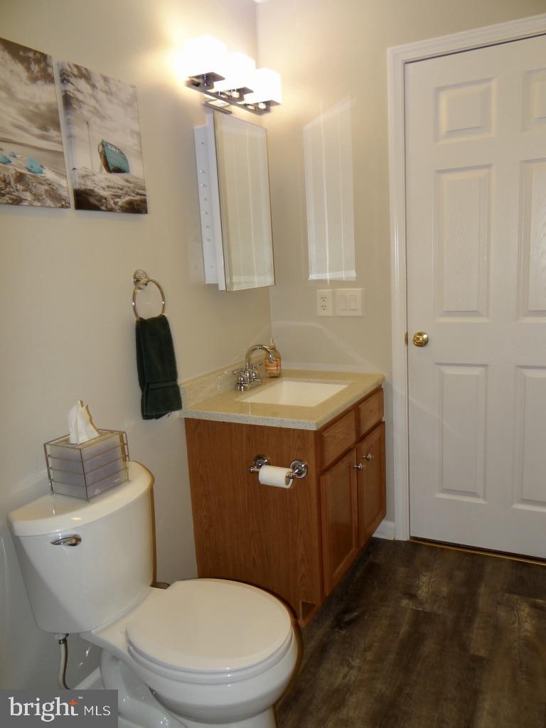 126 Green Street Mount Holly, NJ 08060 - Photo 25 of 41 a bathroom with a sink a toilet and mirror