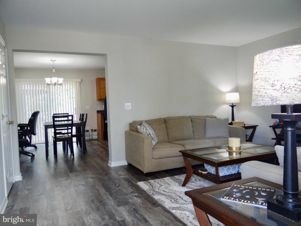 126 Green Street Mount Holly, NJ 08060 - Photo 4 of 41 a living room with furniture a dining table and a large window