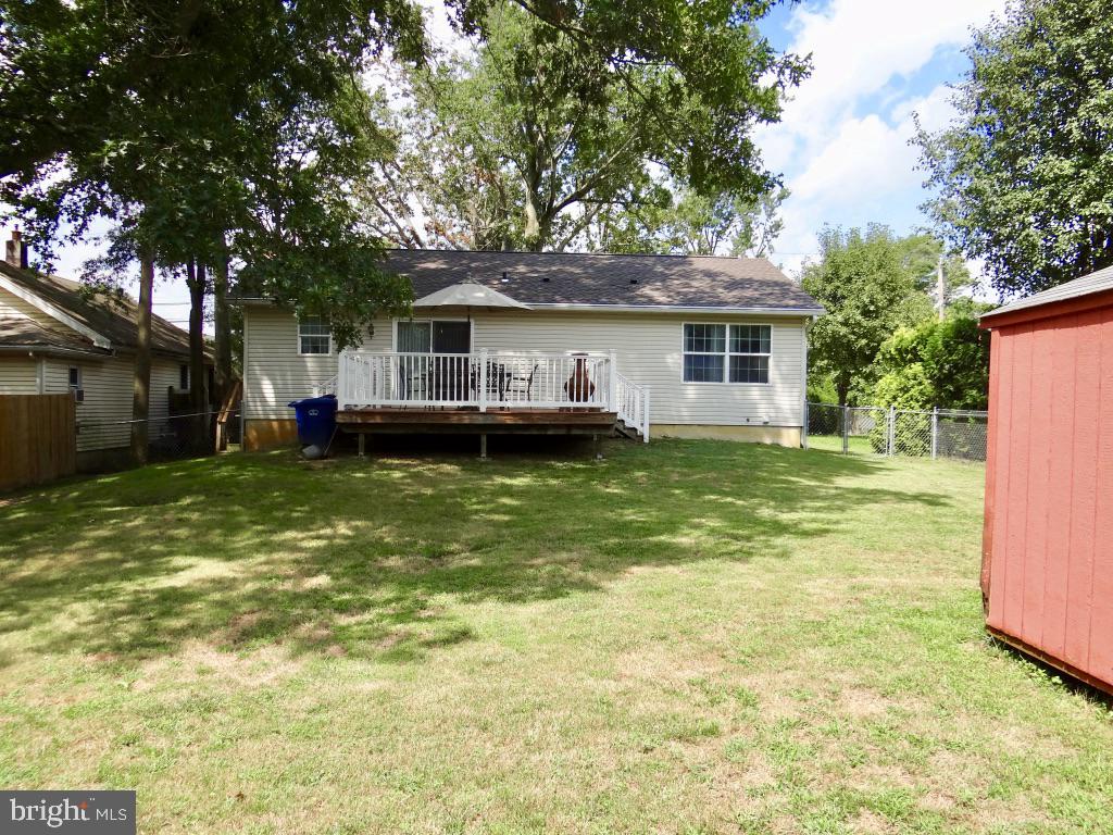 126 Green Street Mount Holly, NJ 08060 - Photo 39 of 41 a backyard of a house with yard table and chairs
