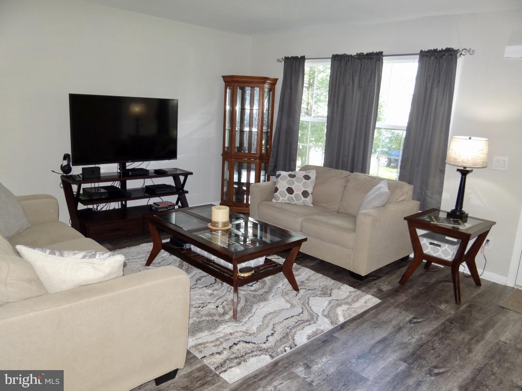 126 Green Street Mount Holly, NJ 08060 - Photo 5 of 41 a living room with furniture and a flat screen tv
